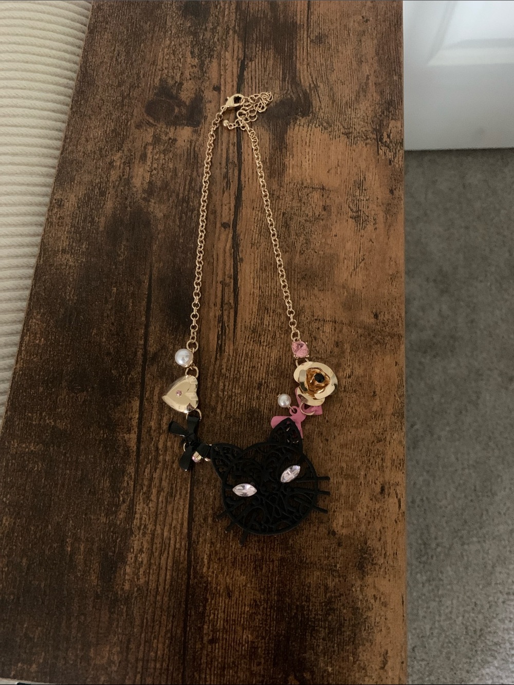 Gold-Tone Necklace with Black Cat Pendant and Pink Accents